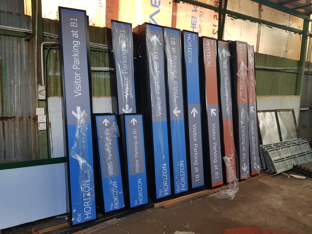 a group of way finding signs in a building